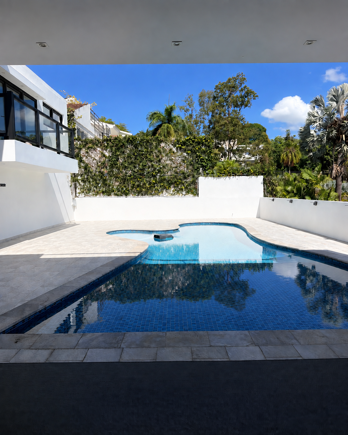 Design rendering of the private pool with an open stone patio and no sun loungers